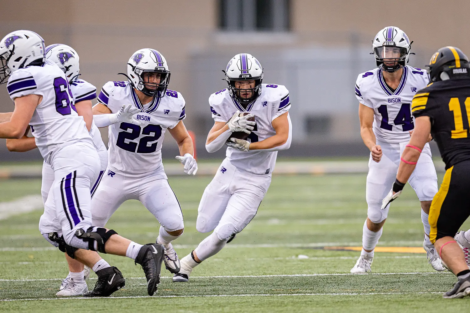 Buffalo RB getting blocks from teammates as he runs down the field