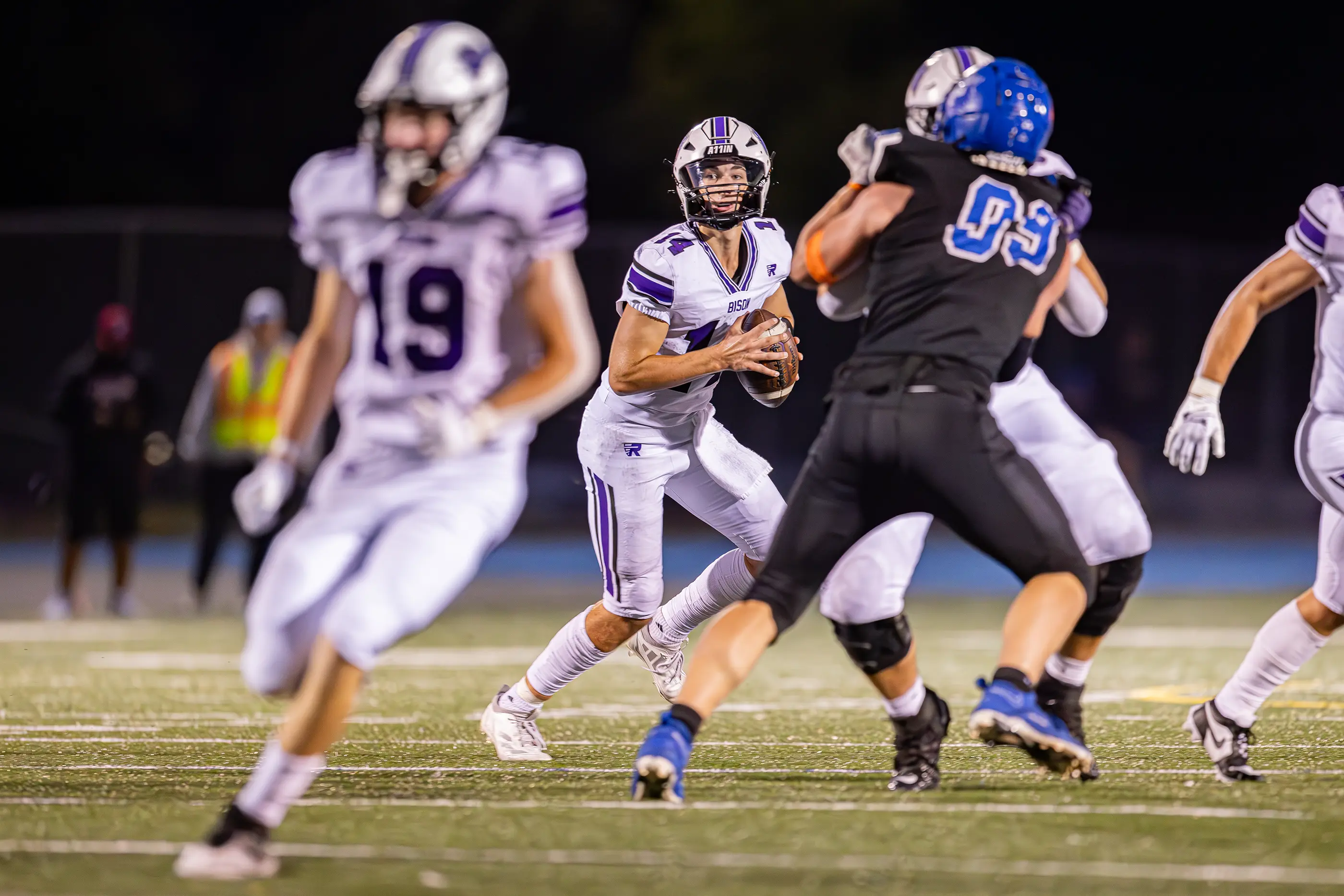 QB rolling out looking down field