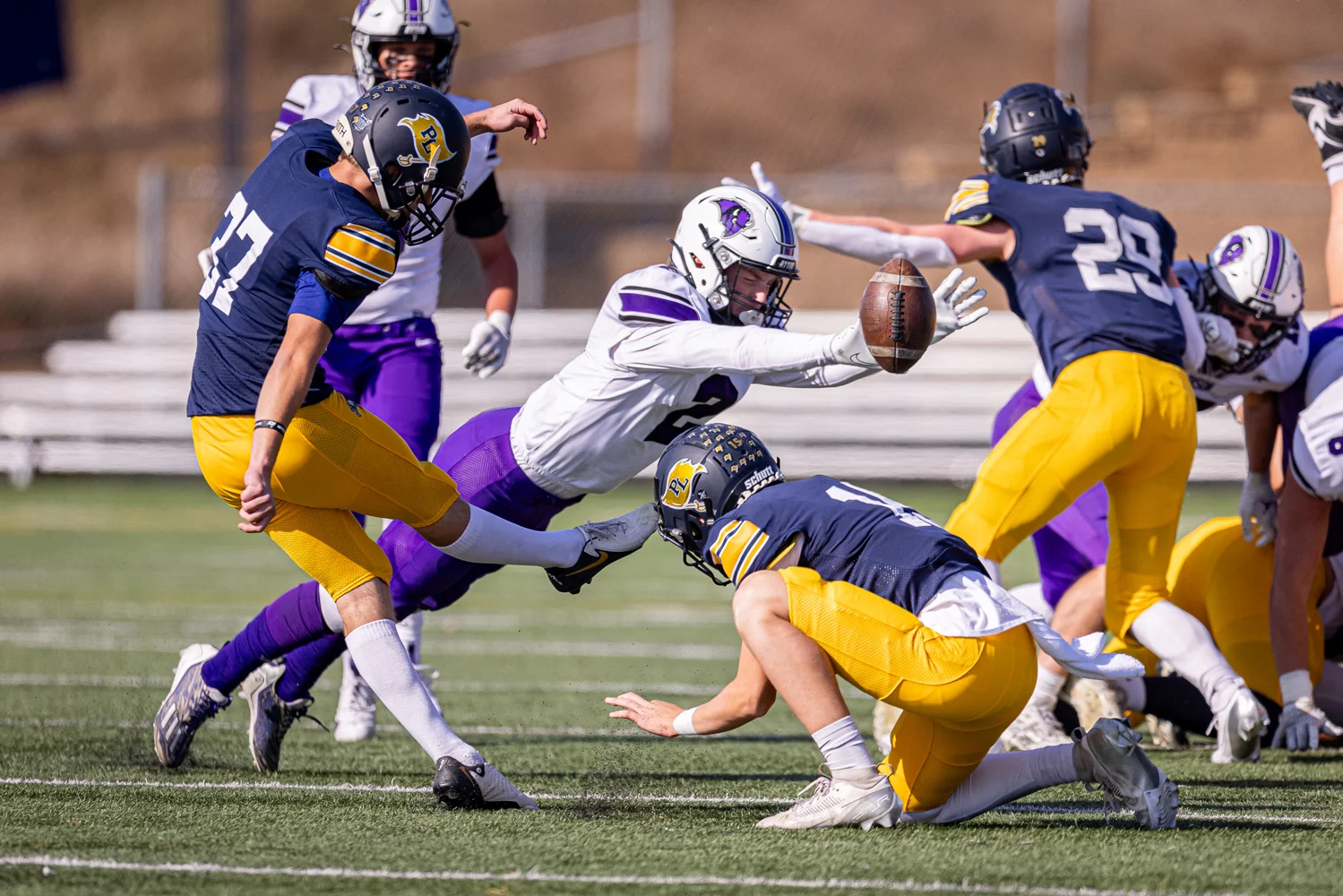 Bison player reaching out to block the FG attempt