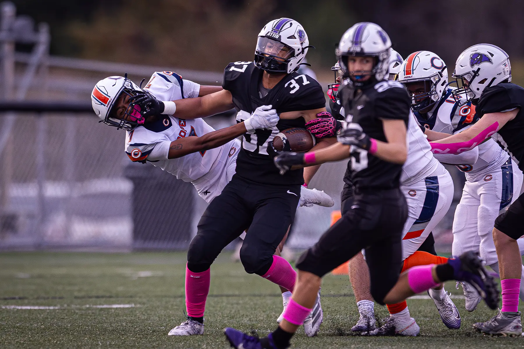 RB fighting off the tackle