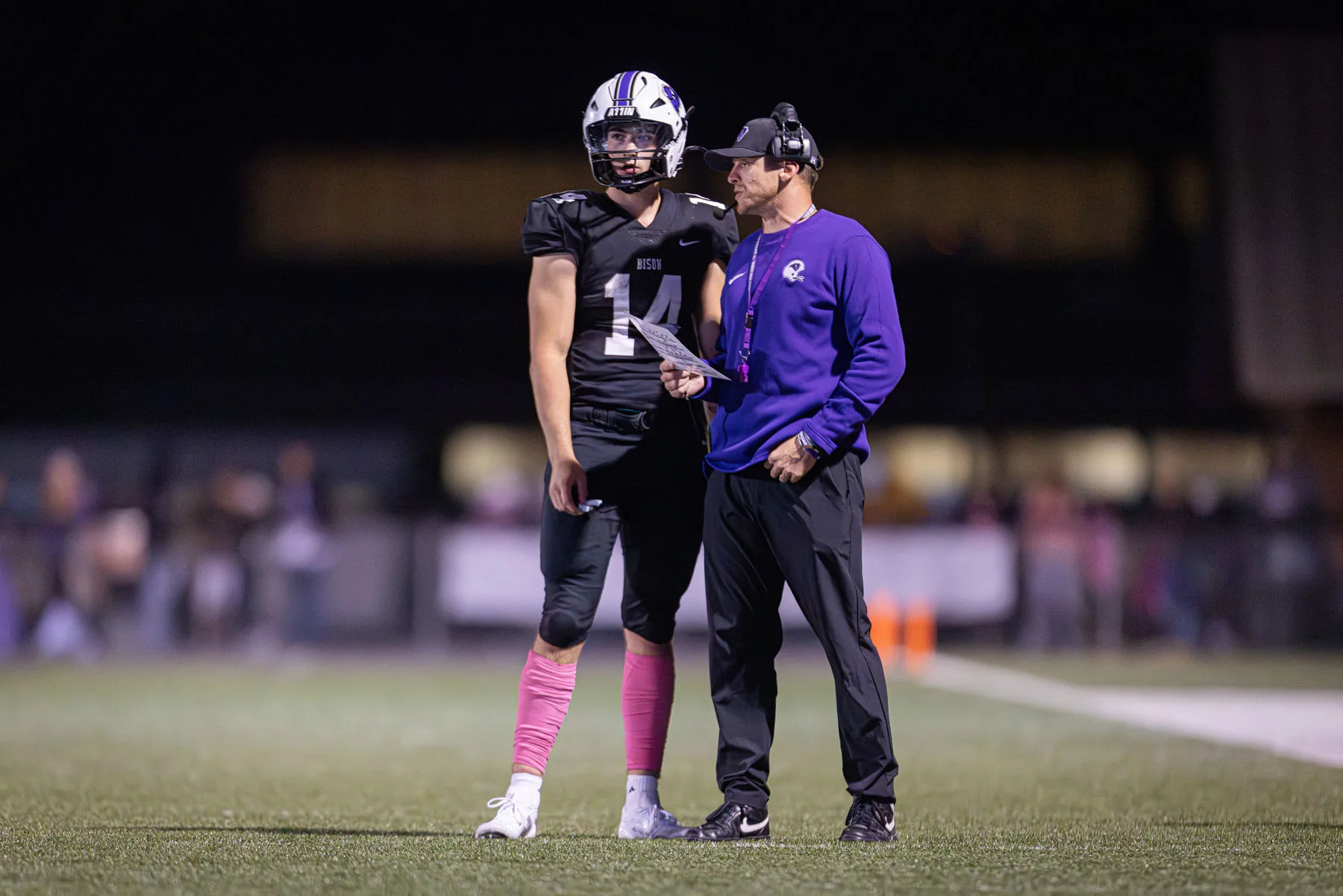 Coach talking to the QB