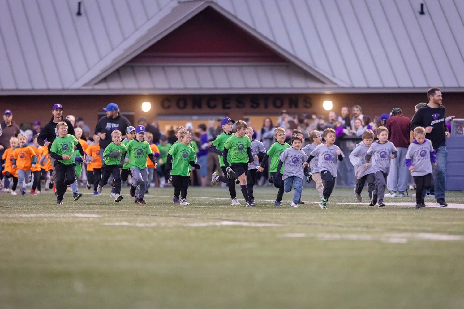 Junior Football players hitting the field